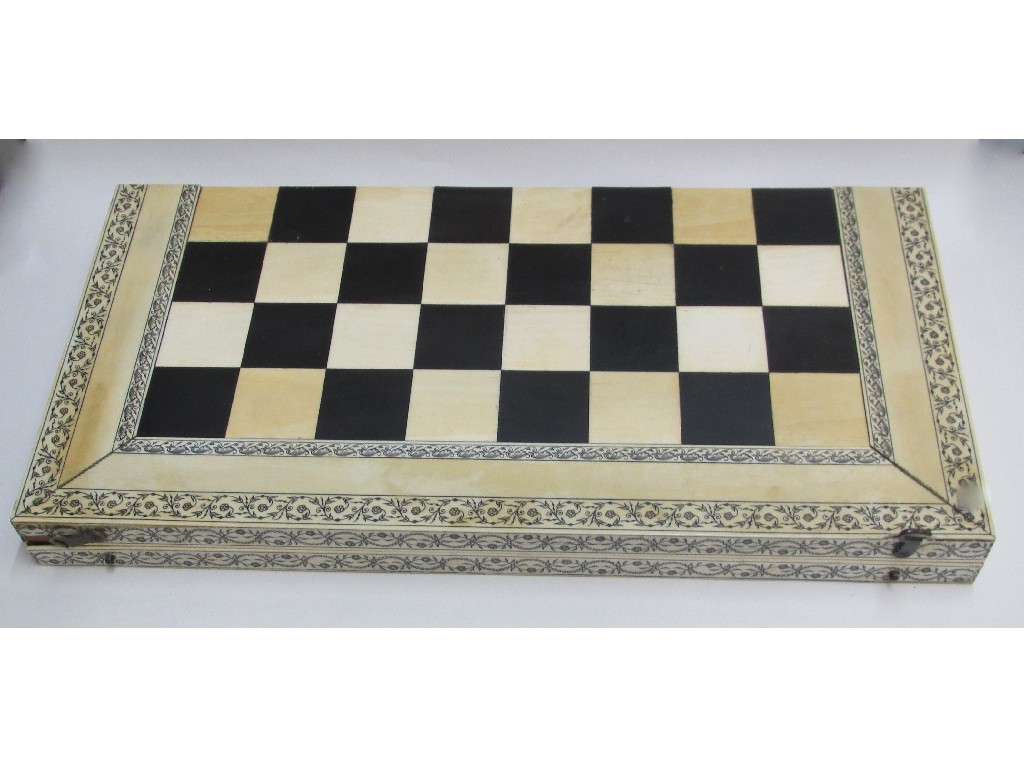 Appraisal: A Vizagapatam ivory and ebony games board the exterior with