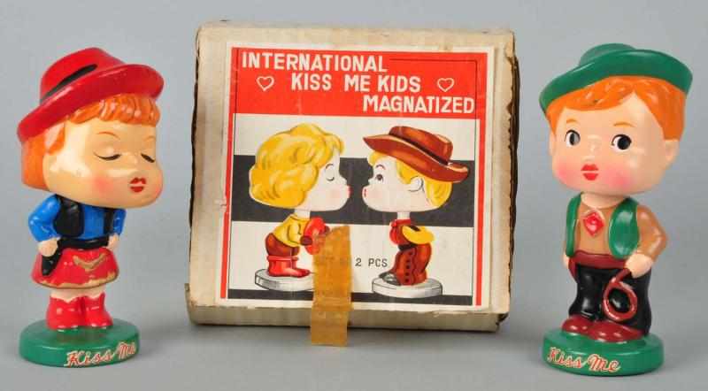 Appraisal: International Kiss Me Kids Bobbing Head Dolls Set Description Both