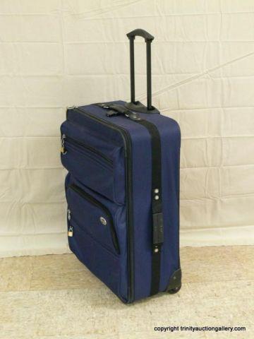 Appraisal: American Tourister Large Travel Suitcase - with external storage Has