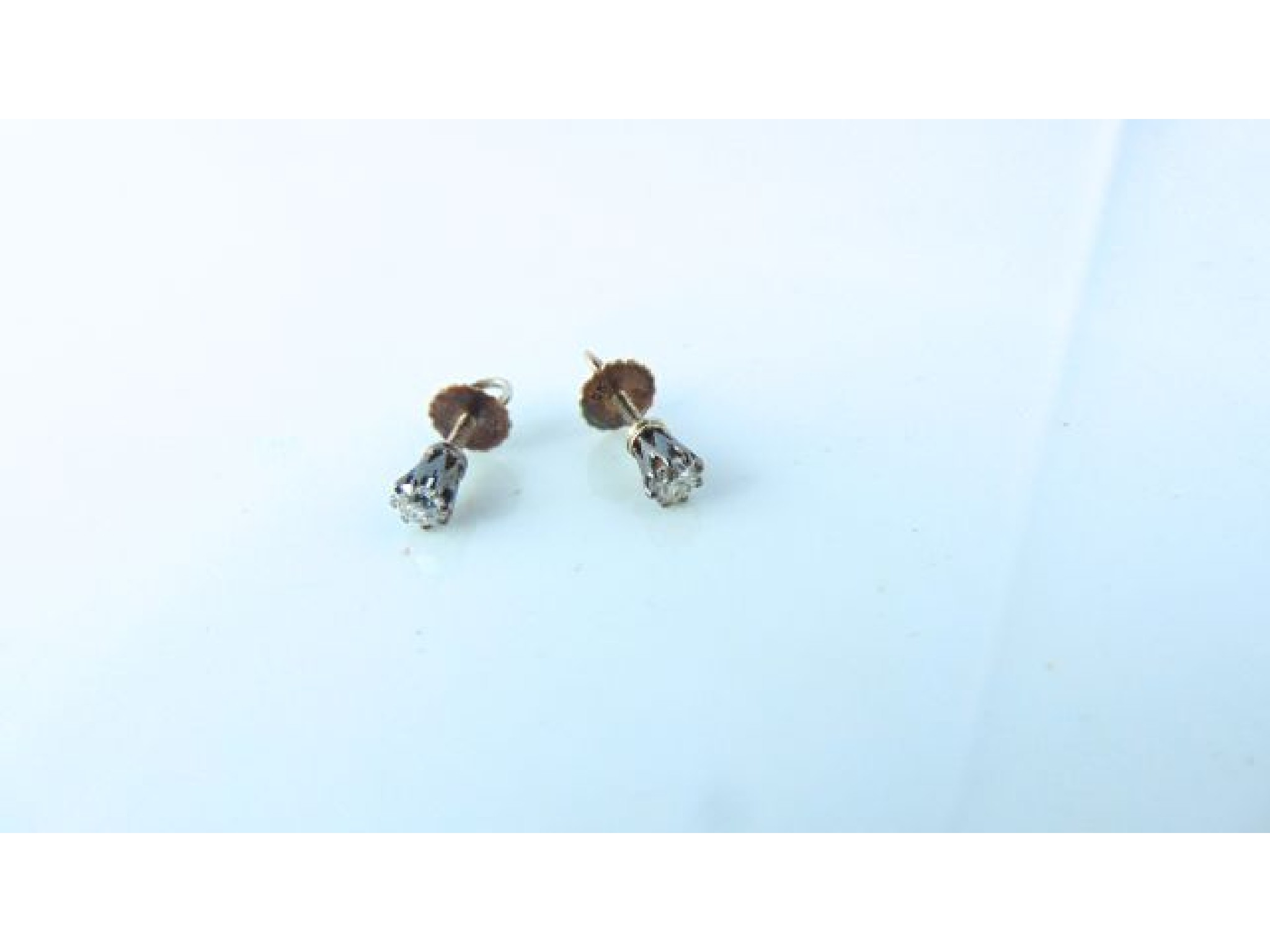 Appraisal: A pair of diamond stud earrings each claw-set with an