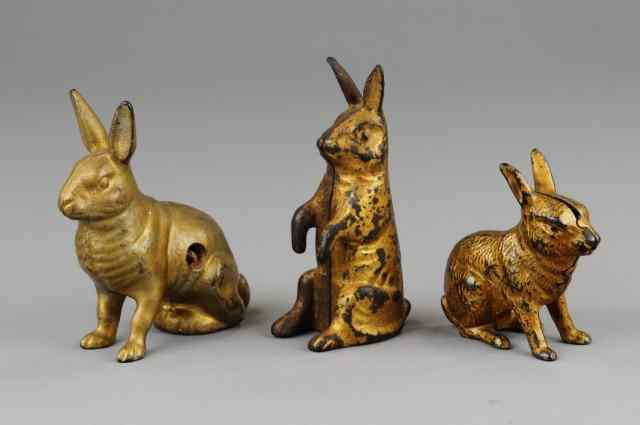 Appraisal: LOT OF THREE RABBIT STILL BANKS Cast iron each painted