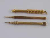 Appraisal: Two untested yellow metal mechanical pencils and a gold plated