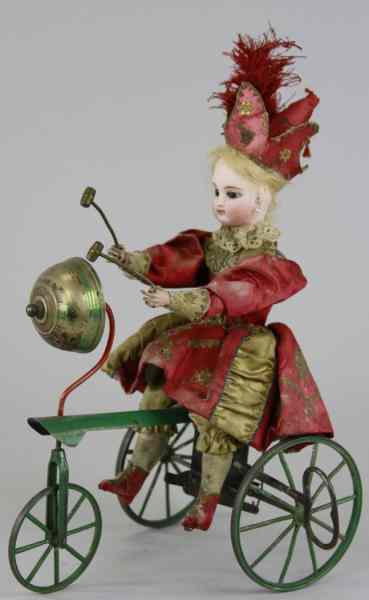 Appraisal: VICHY MECHANICAL GIRL ON TRICYCLE France early bisque head girl