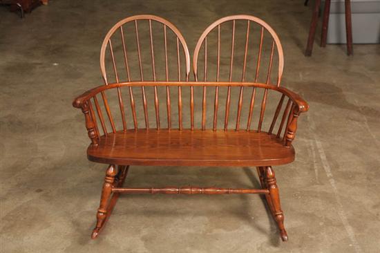 Appraisal: NICHOLS AND STONE WINDSOR STYLE ROCKING BENCH Oak double seat