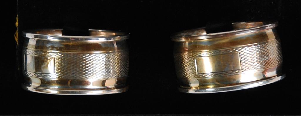 Appraisal: CASED PAIR OF ENGINE TURNED SILVER NAPKIN RINGS Birmingham oz