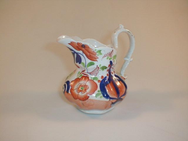 Appraisal: A Swansea Cumbrian pottery Cymro stone china jug painted in