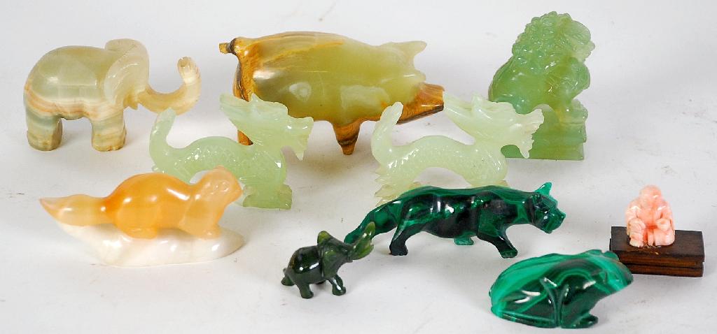 Appraisal: PAIR OF ORIENTAL CARVED JADE MODELS OF DRAGONS long ANOTHER