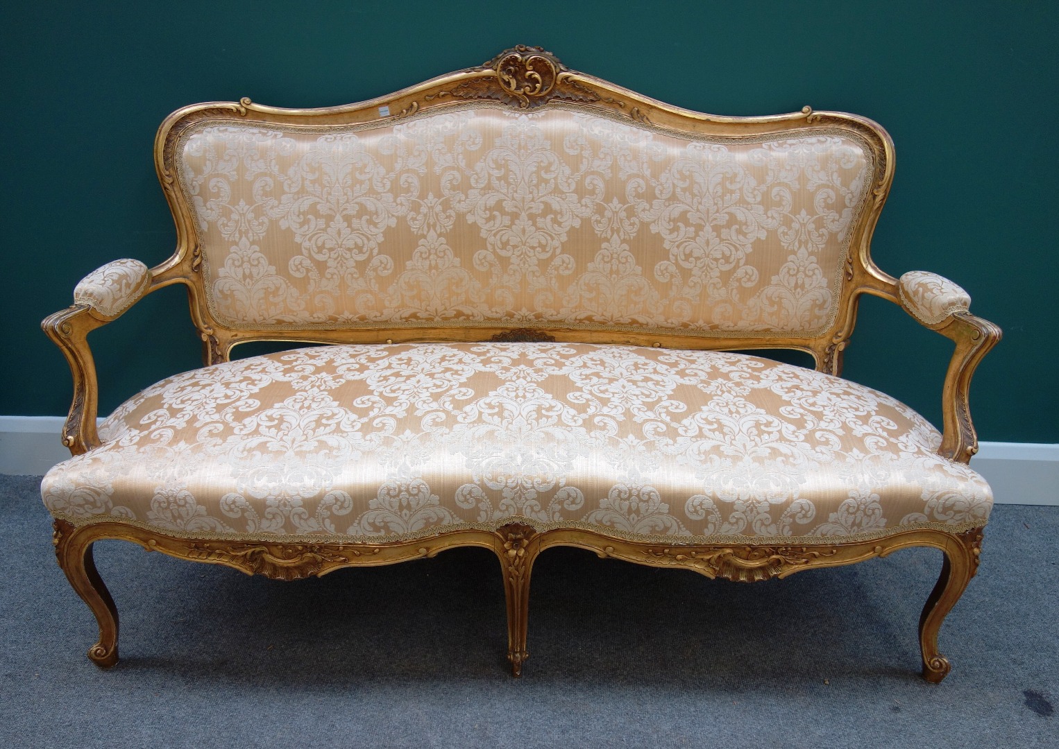 Appraisal: A Louis XV style gilt framed sofa with carved and