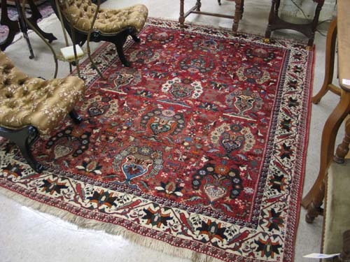 Appraisal: PERSIAN SHIRAZ CARPET hand knotted in a repeating vase and