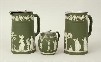 Appraisal: Three Wedgwood Green Jasperware Pitchers Two with silverplate lids marked