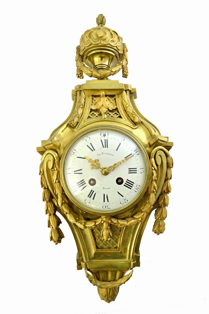 Appraisal: A French gilt bronze striking cartel clock of Louis XVI