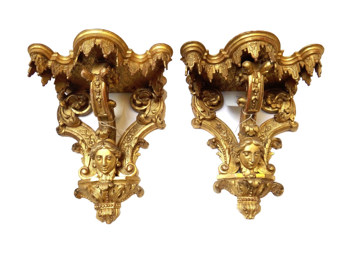 Appraisal: A pair of giltwood wall brackets th century the shaped