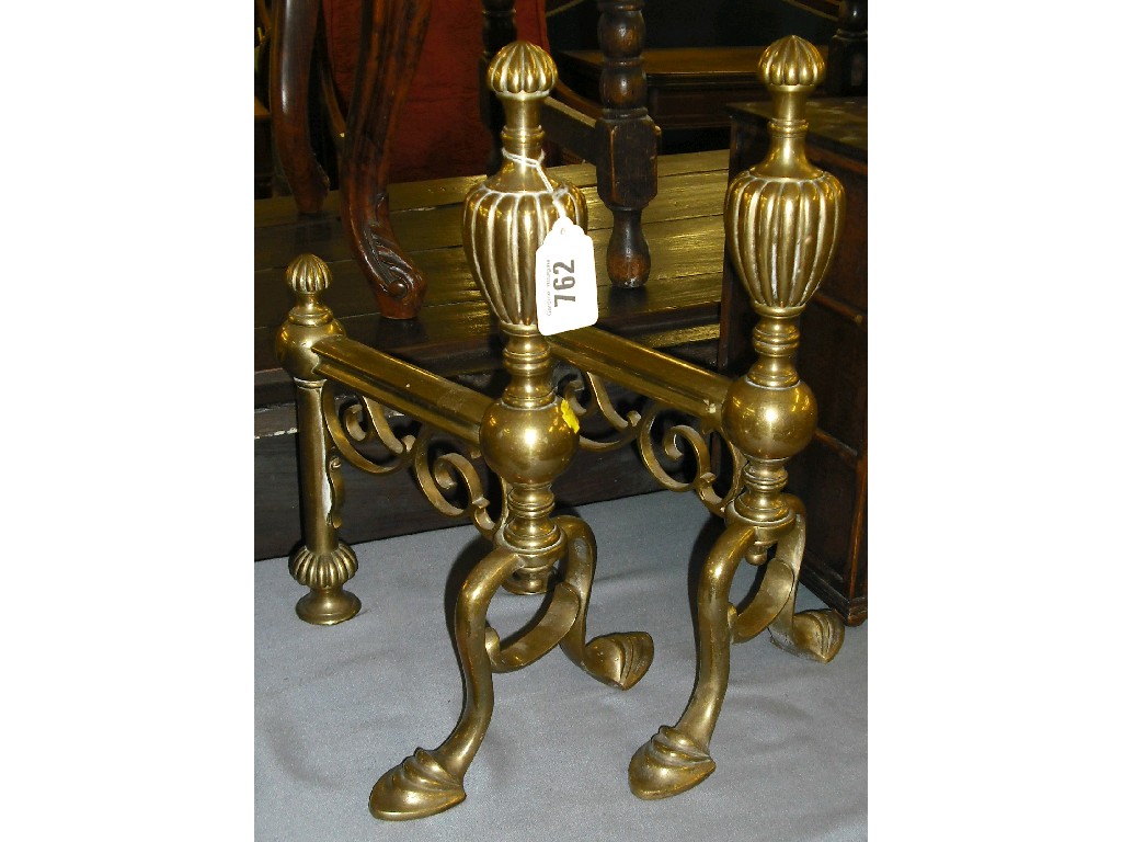 Appraisal: Pair of brass fire dogs with fluted finials high