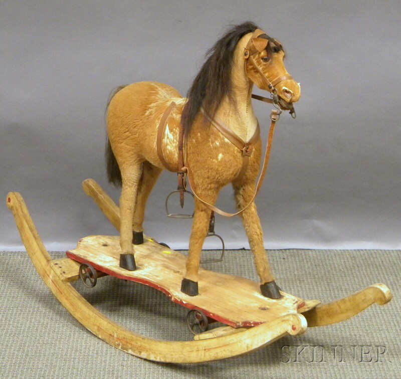 Appraisal: th Century Hide-clad Ride-on Rocking Horse with glass eyes and