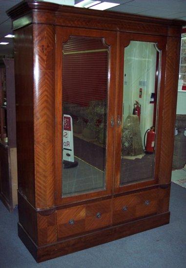 Appraisal: A Victorian mahogany wardrobe with moulded cornice and rounded corners