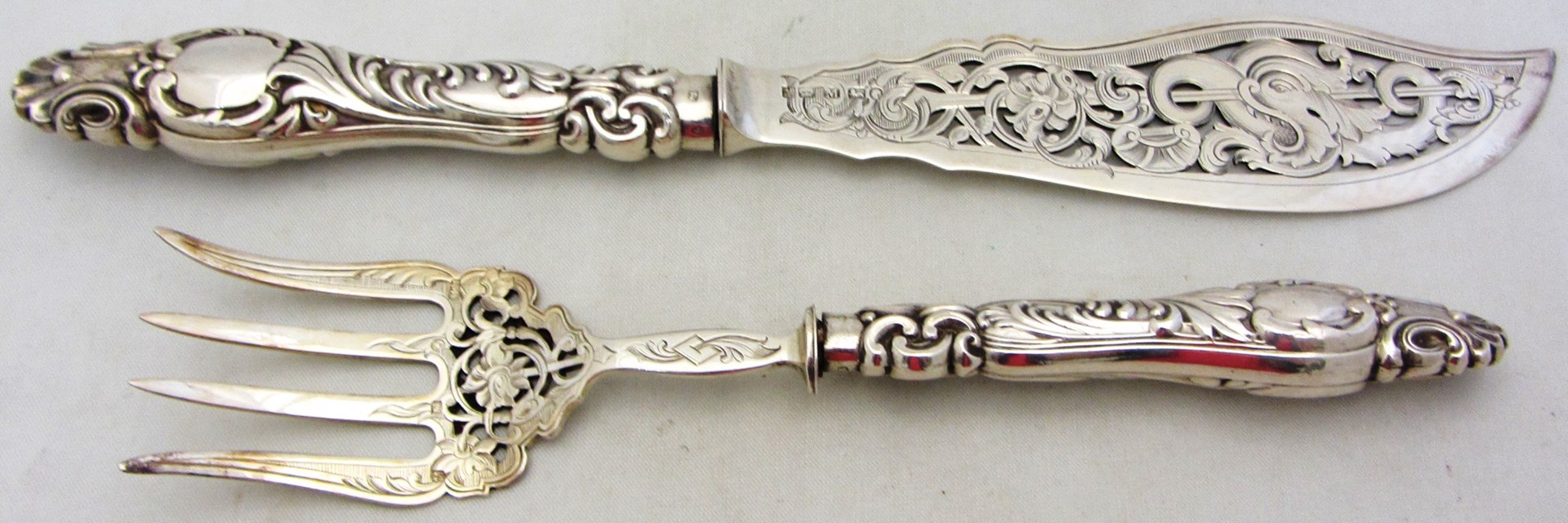 Appraisal: A pair of Victorian silver fish servers with pierced and