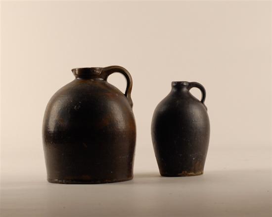 Appraisal: Two Stoneware Jugs each with brown glazing the largest with