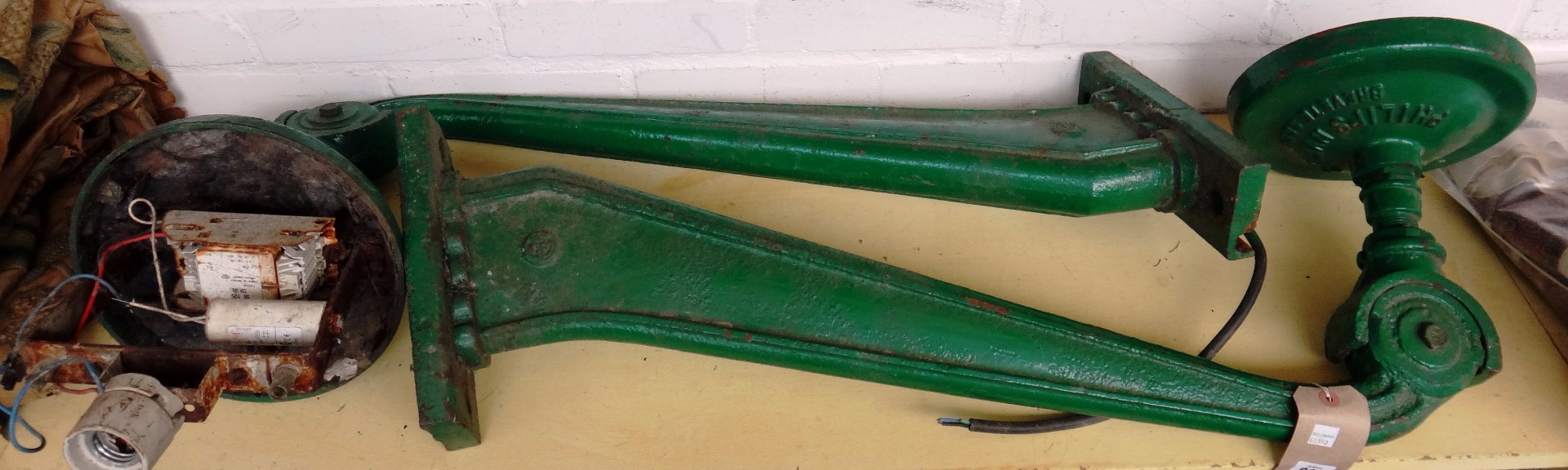 Appraisal: A pair of green painted cast iron industrial wall lights