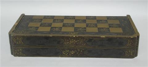 Appraisal: CHINESE BLACK LACQUERED GAMES BOX The interior for backgammon the