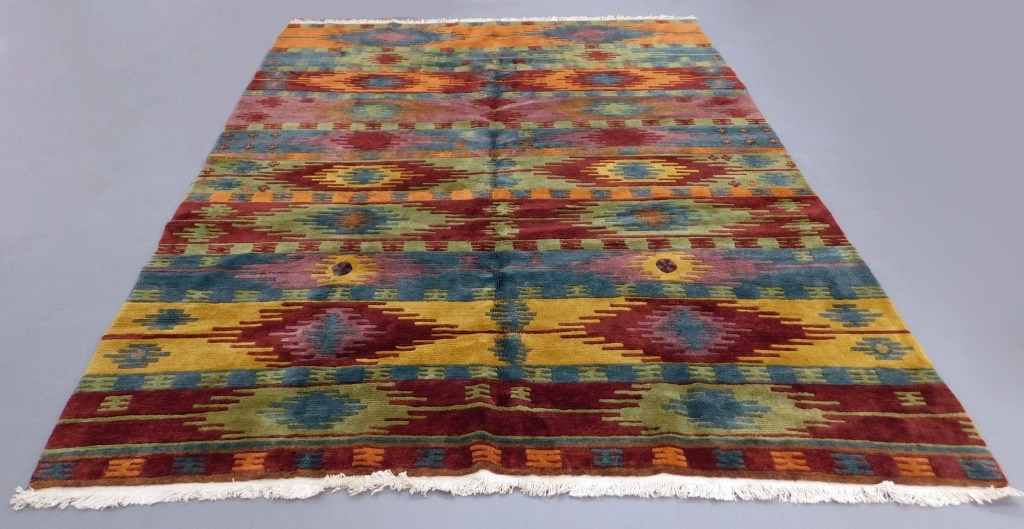 Appraisal: TIBETAN ORANGE GREEN GEOMETRIC RUG Tibet th Century Red orange