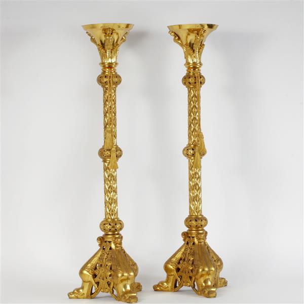 Appraisal: Pair of Baroque style brass floor candlesticks raised on mythical-beast