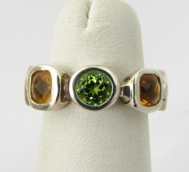 Appraisal: Custom made sterling silver peridot and citrine band made by