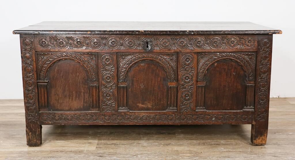 Appraisal: Early Continental carved blanket chest Carved floral motifs shield form