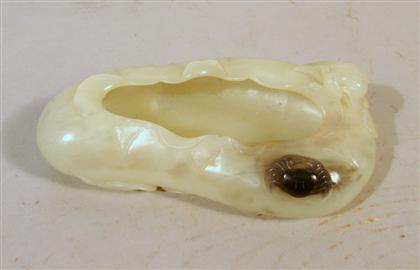 Appraisal: Chinese white jade brush washer Of organic lotus-leaf form with