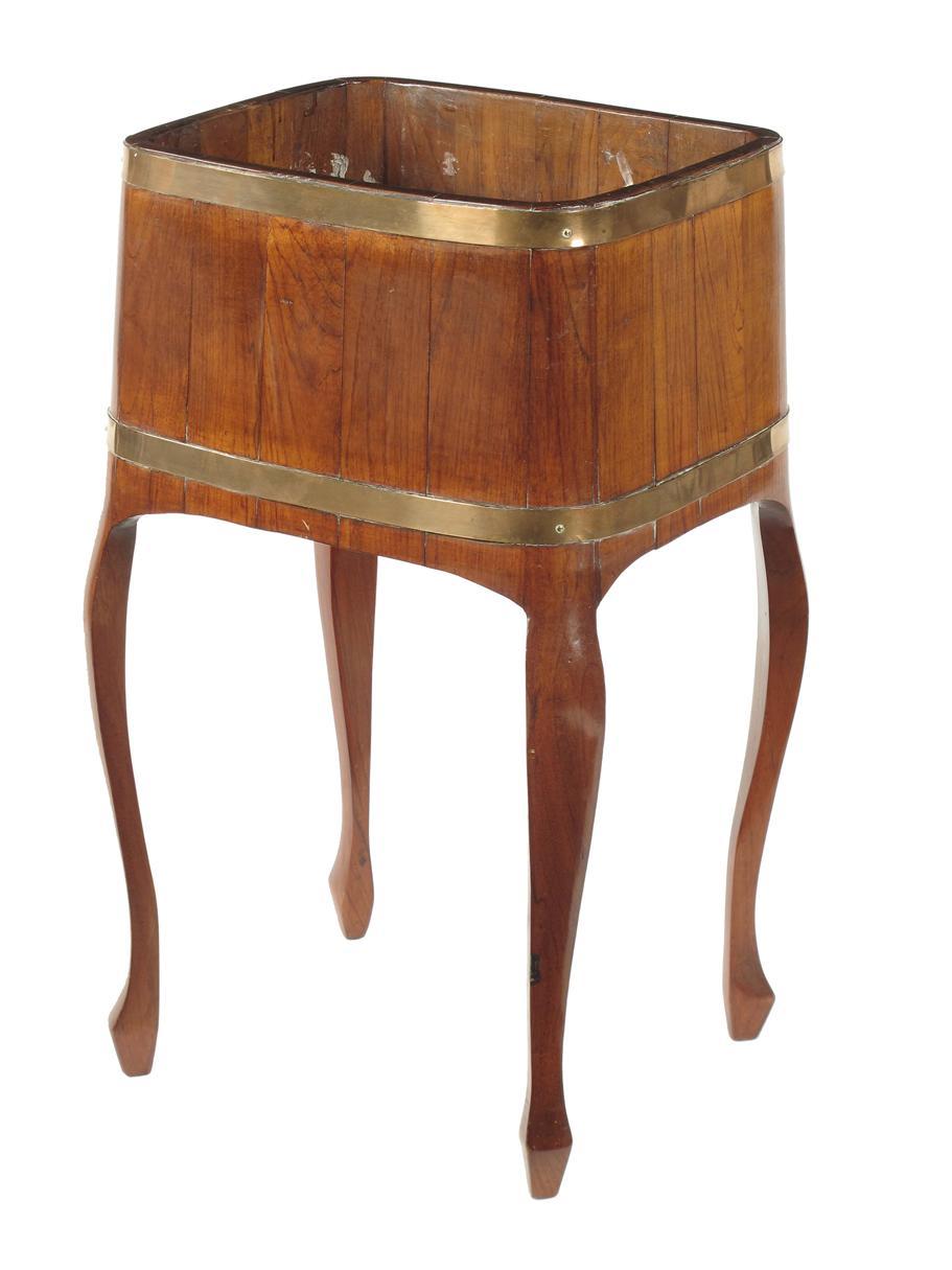 Appraisal: A teak and brass bound jardiniere