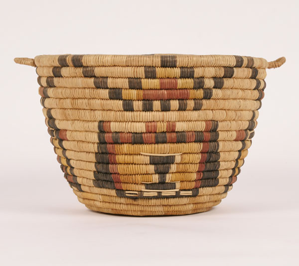 Appraisal: Tightly coiled Hopi polychrome basket with handles H