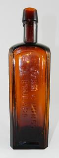 Appraisal: Bitters bottle Bitters- square marked vertically on indented panels 'Rising