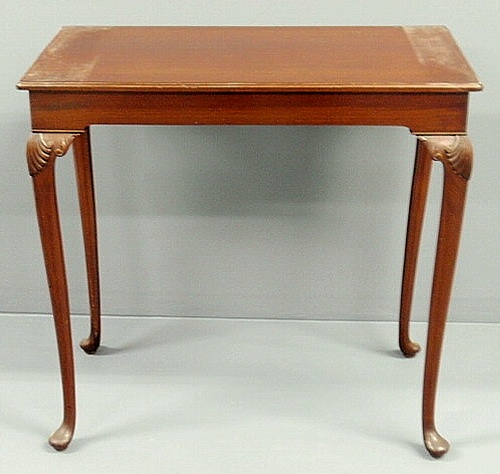 Appraisal: Queen Anne style mahogany table with shell carved knees and