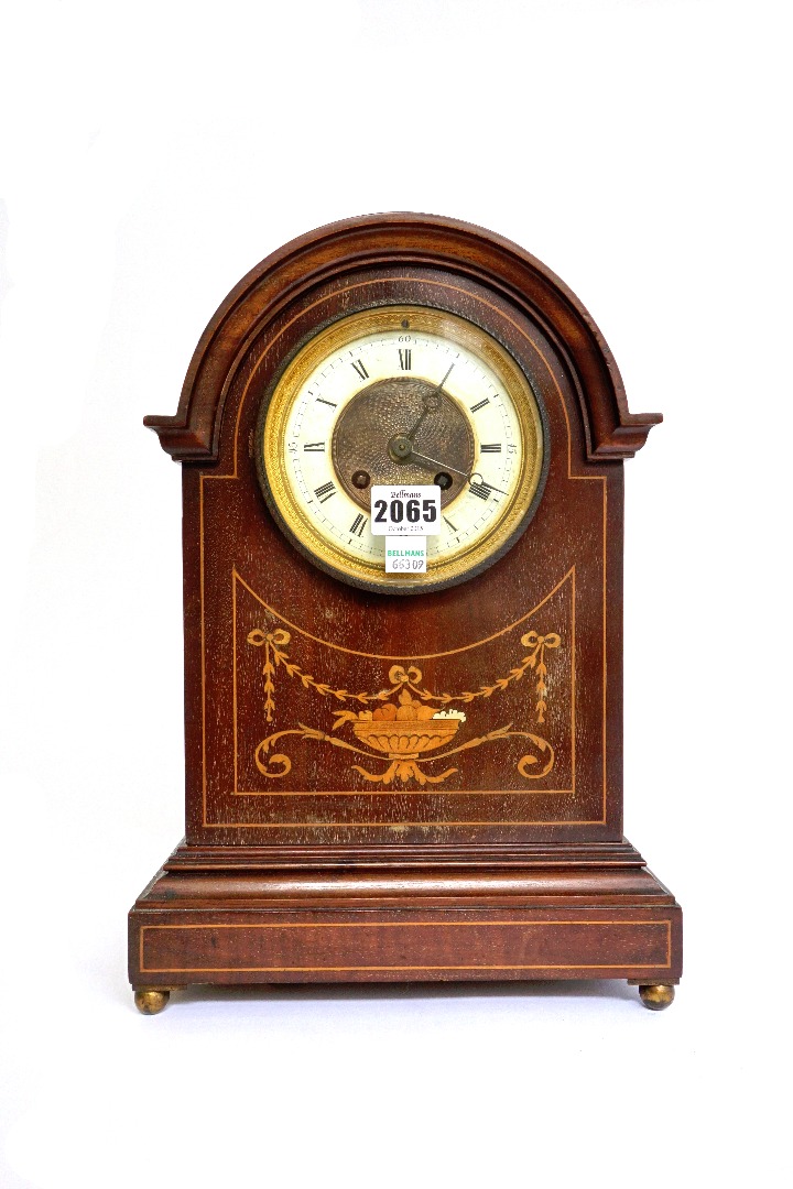 Appraisal: An Edwardian mahogany and inlaid mantel clock with domed case