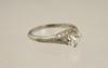 Appraisal: LADY'S RING - A four prong ct diamond accented with