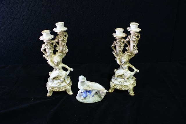 Appraisal: A pair of Capodimonte candle sticks together with a figure