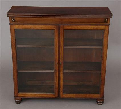 Appraisal: REGENCY MAHOGANY SIDE CABINET With hinged folding rectangular top above