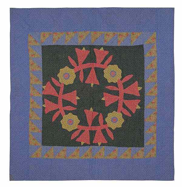 Appraisal: Pennsylvania pieced crib quilt ca with a central floral wreath