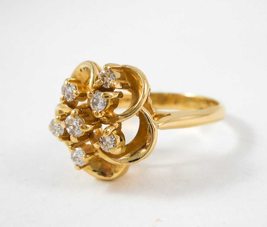 Appraisal: DIAMOND AND FOURTEEN KARAT GOLD RING The yellow gold ring