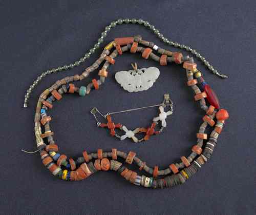 Appraisal: Carved butterfly pendant together with two beaded necklaces a bracelet