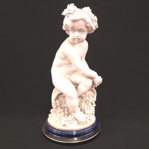 Appraisal: L Badessi Porcelain Figurine of a Seated Child nude seated