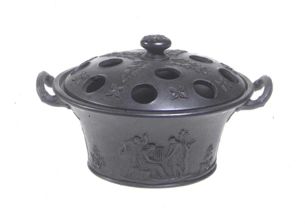 Appraisal: A WEDGWOOD BLACK BASALT VIOLET BASKET AND COVER ornamented with