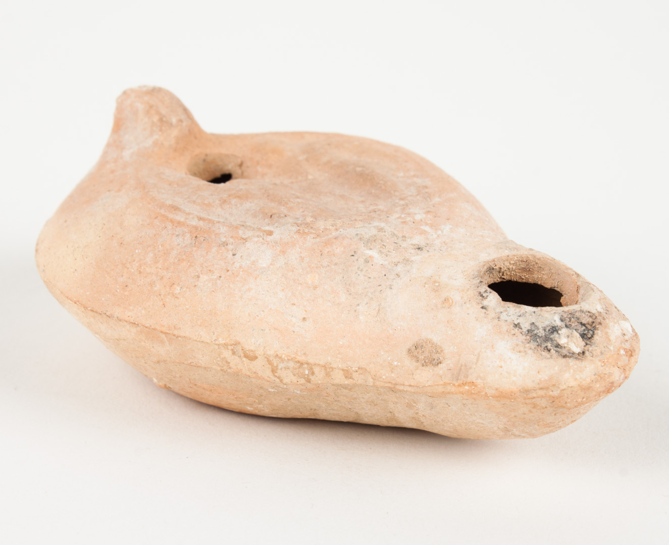 Appraisal: Roman terracotta oil lamp with gladiators modelled in relief on