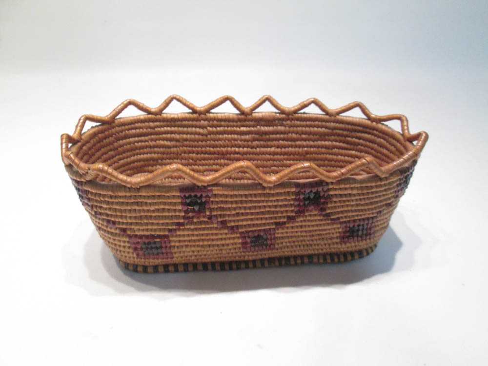 Appraisal: THOMPSON RIVER WOVEN BASKET oblong with polychrome geometric motif and