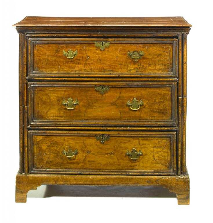 Appraisal: A NORTHERN EUROPEAN WALNUT CHEST OF DRAWERS the moulded top