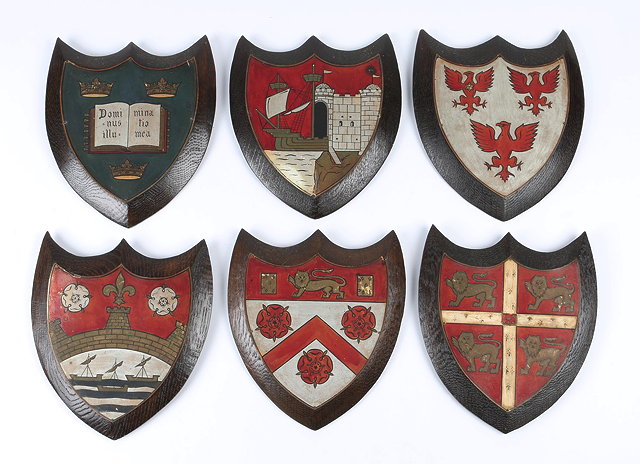 Appraisal: A SET OF SIX LATE VICTORIAN OAK SHIELDS each painted