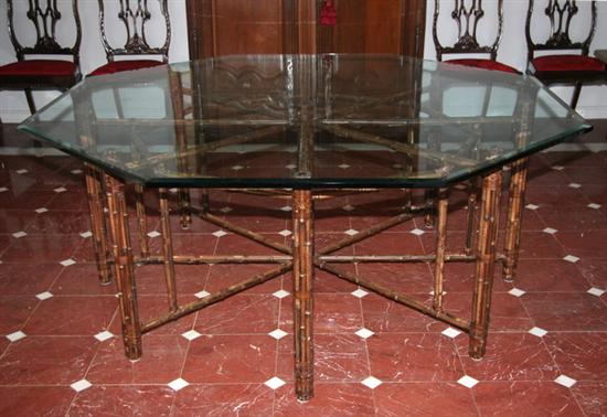 Appraisal: JOHN MCGUIRE OCTAGONAL DINING TABLE th century rattan and rawhide