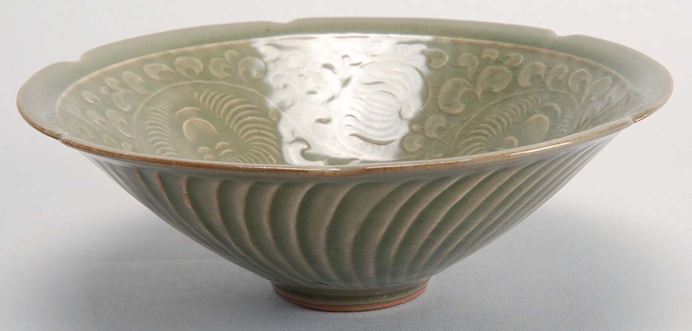 Appraisal: CARVED CELADON BOWL With flower-form rim and incised peony design