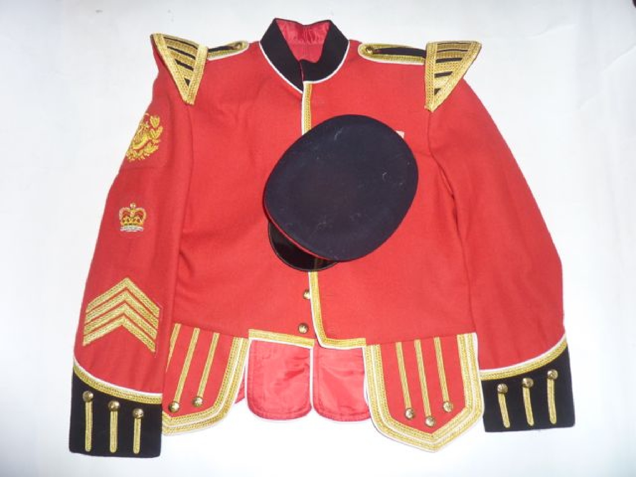 Appraisal: A Royal Artillery red ground jacket with sergeant stripes and