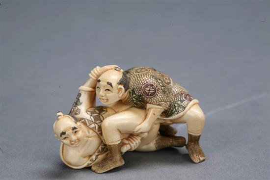 Appraisal: IVORY CARVING Japan Erotic okimono carving with two men Polychrome