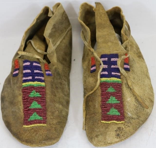 Appraisal: PAIR OF TH C CENTRAL PLAINS INDIAN BEADEDMOCCASINS LONG GOOD